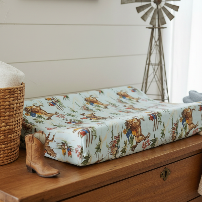 Close up of Barn Dandy Cowboy Western Changing Pad Cover showing mint cowboy print detail