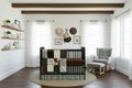 Farmhouse hunter green nursery with brown sheet